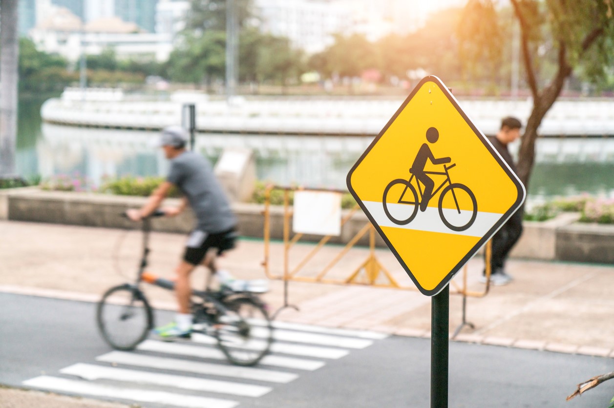 Biker on the road, bicycle sign